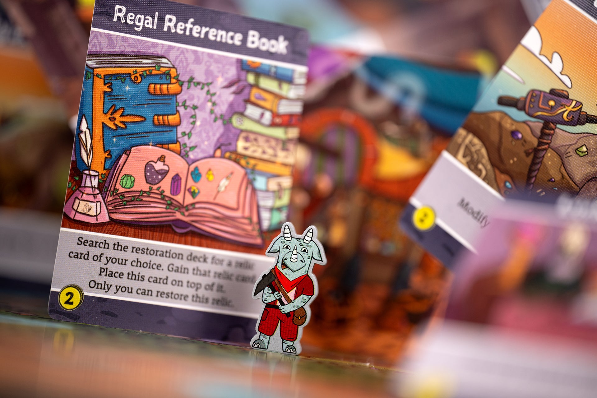 Gems of Iridescia - Kito Explorer token and Regal Reference Book item card